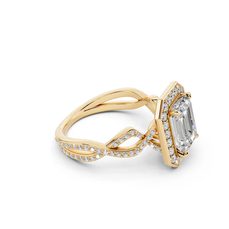 Yellow gold engagement ring with emerald-cut center stone and twisted diamond band