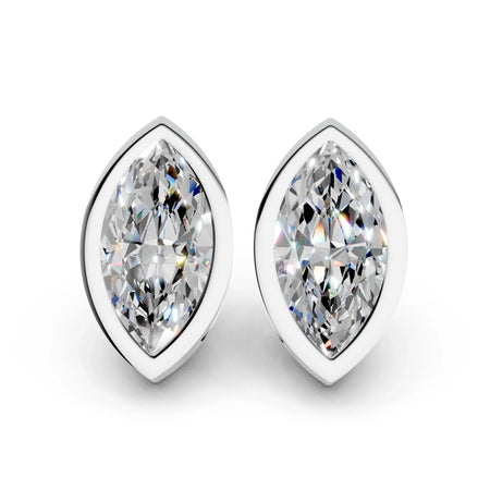 Marquise cut diamond stud earrings in white gold bezel settings on white background