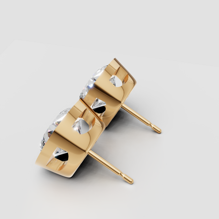Gold stud earrings with round-cut diamonds in bezel settings on white background