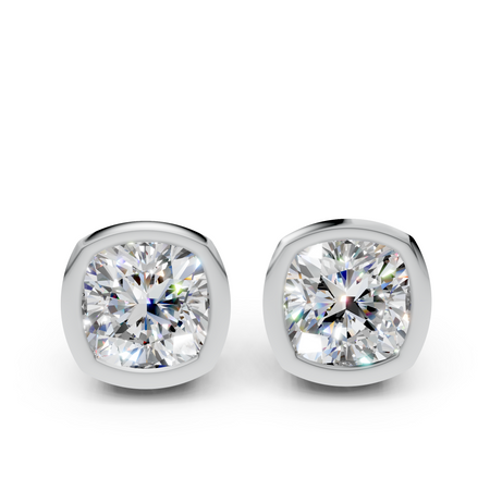 Cushion cut diamond stud earrings in white metal bezel settings on white background