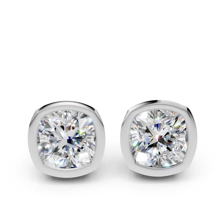 Cushion cut diamond stud earrings in white metal bezel settings on white background