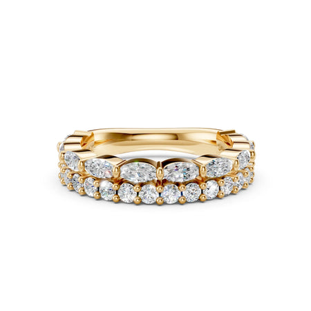 Gold eternity band with oval and round-cut diamonds on white background