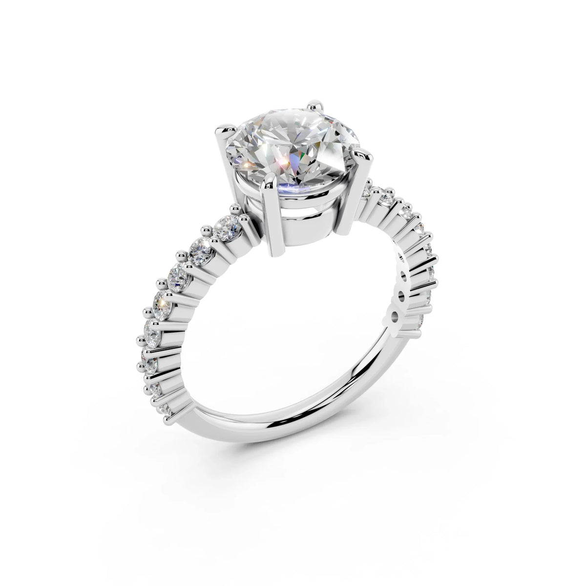 White gold engagement ring with round solitaire diamond and pavé diamond band