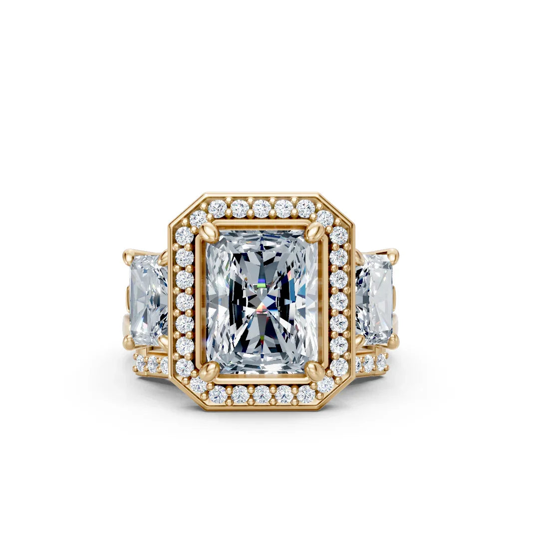 Custom emerald cut diamond engagement ring with halo and side stones in yellow gold
