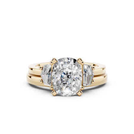 Oval diamond engagement ring with trillion side stones in yellow gold, custom made-to-order jewelry