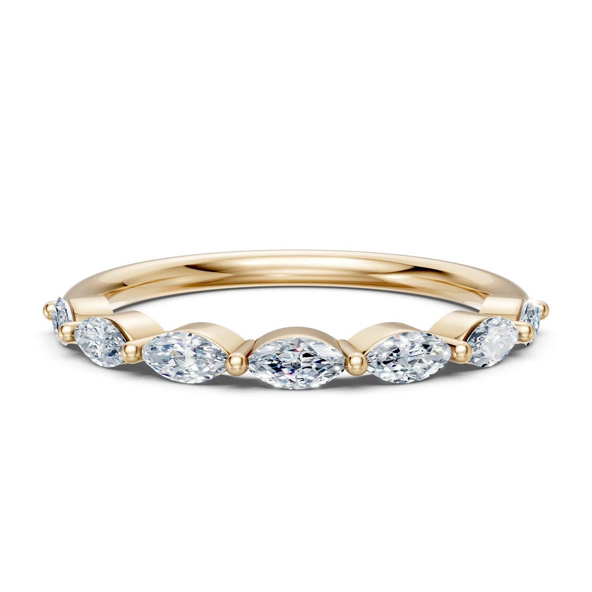 Elegant gold band with oval diamonds, perfect for engagement or wedding rings.
