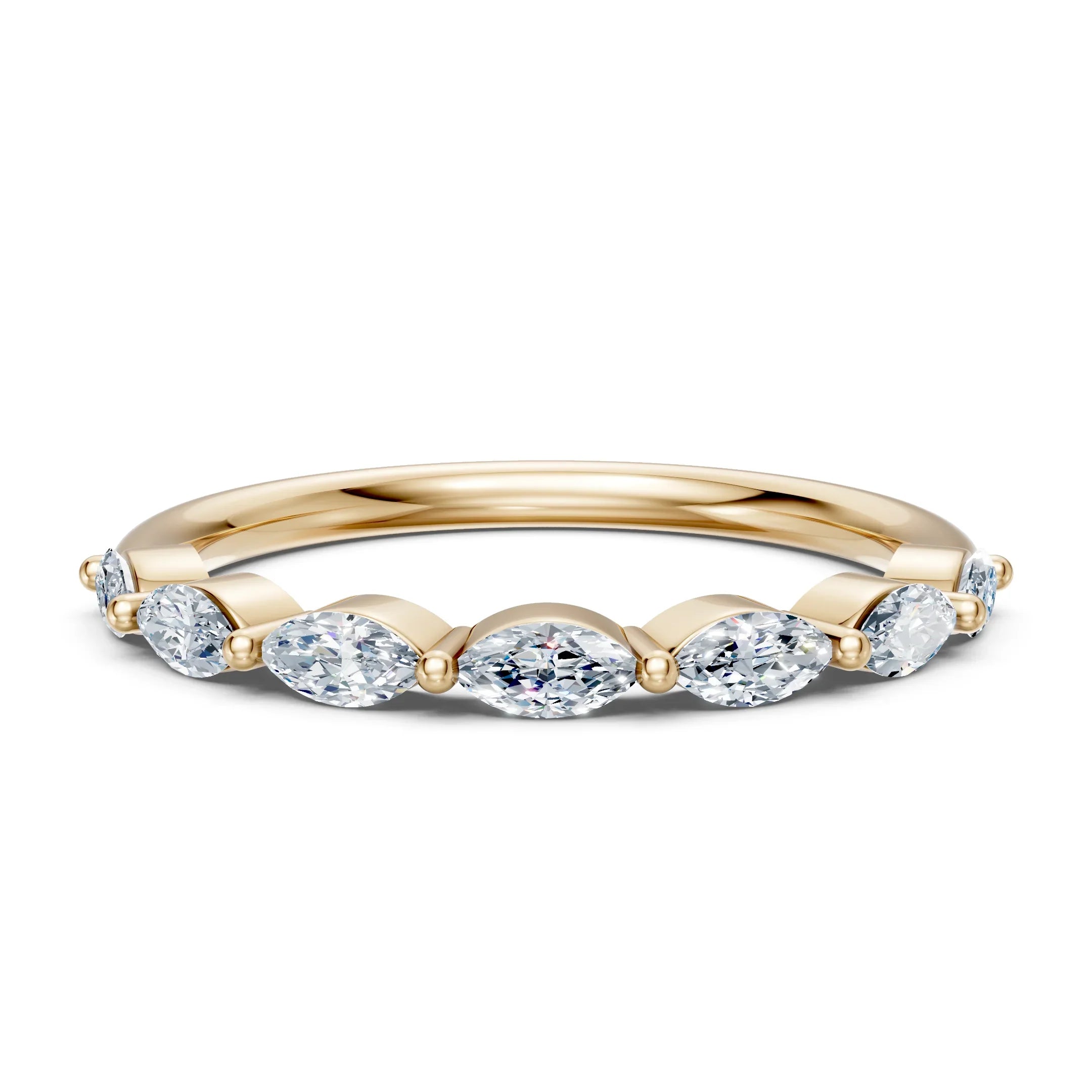 Elegant gold band with oval diamonds, perfect for engagement or wedding rings.