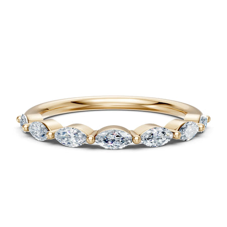 Elegant gold band with oval diamonds, perfect for engagement or wedding rings.