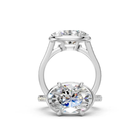 Elegant oval diamond engagement ring with side accents and sleek band design