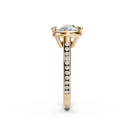 Yellow gold engagement ring with round diamond center and channel-set side stones