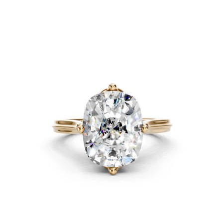 Oval diamond engagement ring in yellow gold, custom-made with payment plans available