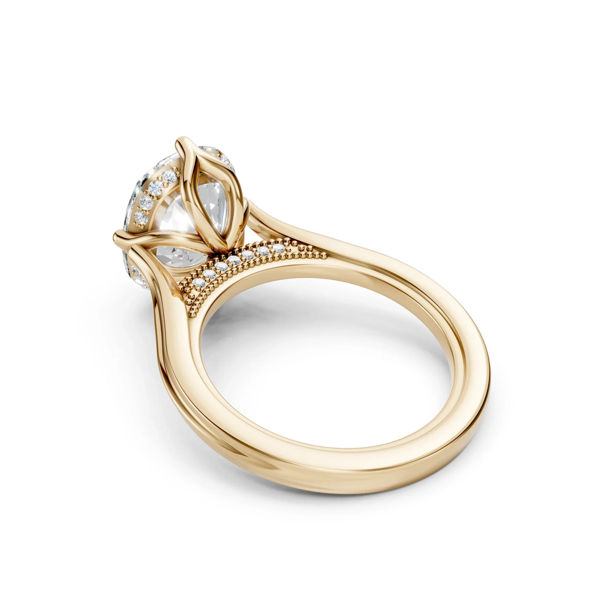 Elegant gold engagement ring with diamond accents and intricate leaf-inspired design