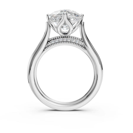 Custom engagement ring with round diamond, side accents, and milgrain detailing on white gold band