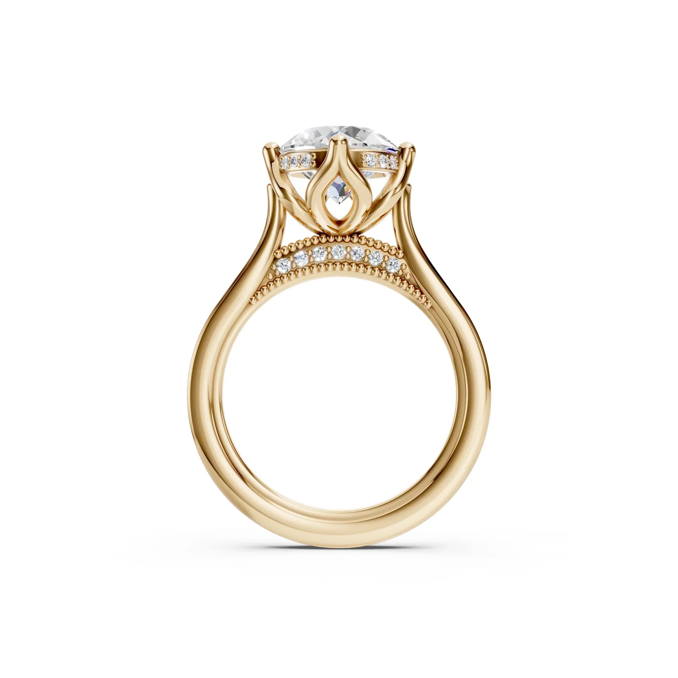 Luxury gold engagement ring with round diamond center, diamond accents, and intricate band design