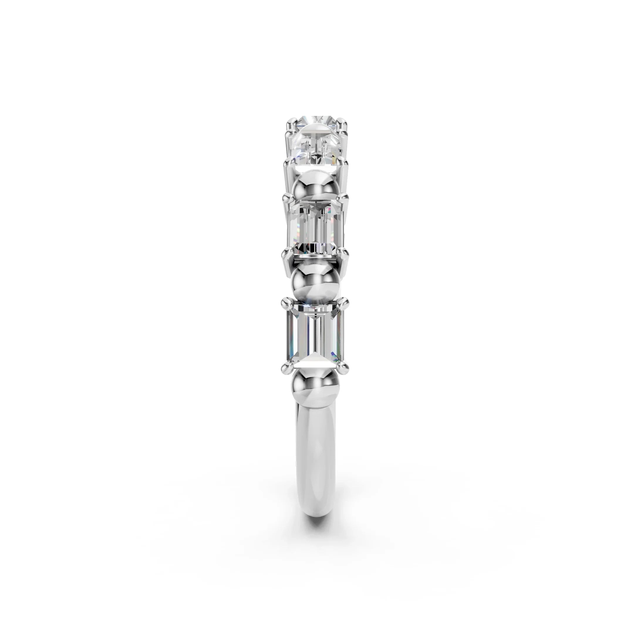 Side view of a white gold ring featuring three emerald-cut diamonds
