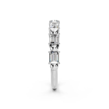Side view of a white gold ring featuring three emerald-cut diamonds