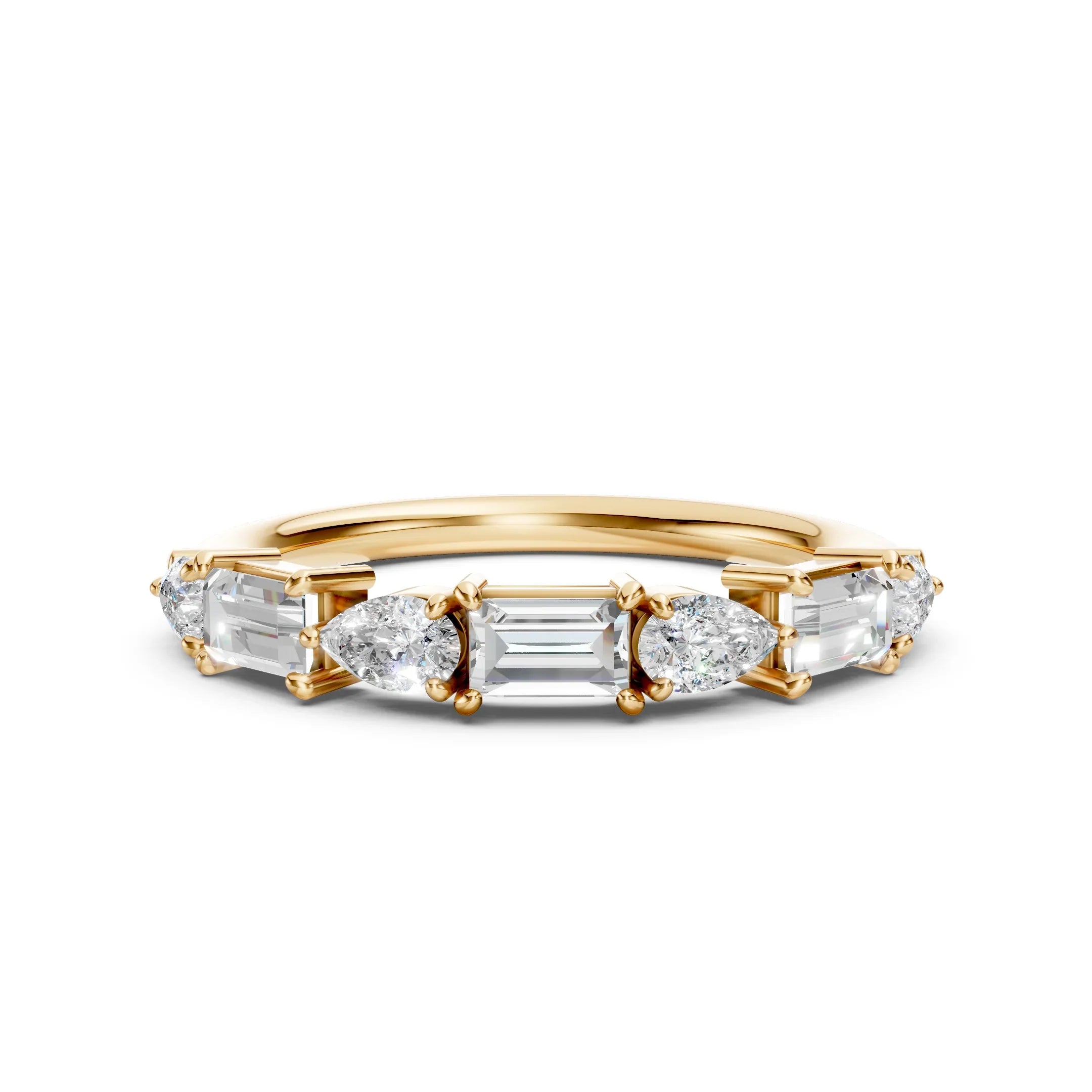 Custom yellow gold wedding band with alternating emerald and pear-cut diamonds