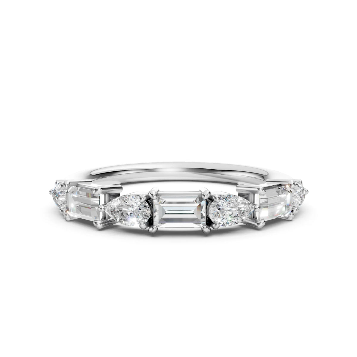 Custom white gold wedding band featuring pear and baguette diamond accents