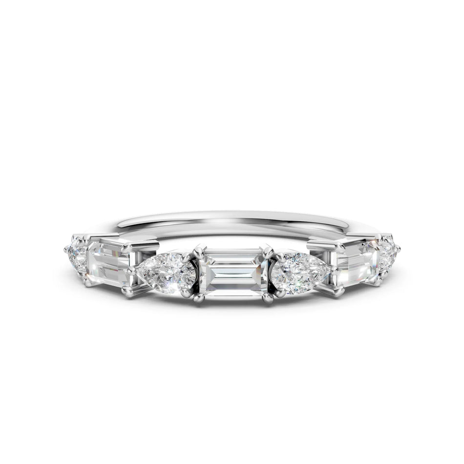 Custom white gold wedding band featuring pear and baguette diamond accents