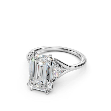 Three stone lab diamond engagement ring by Bel Viaggio Designs with an emerald cut center stone.