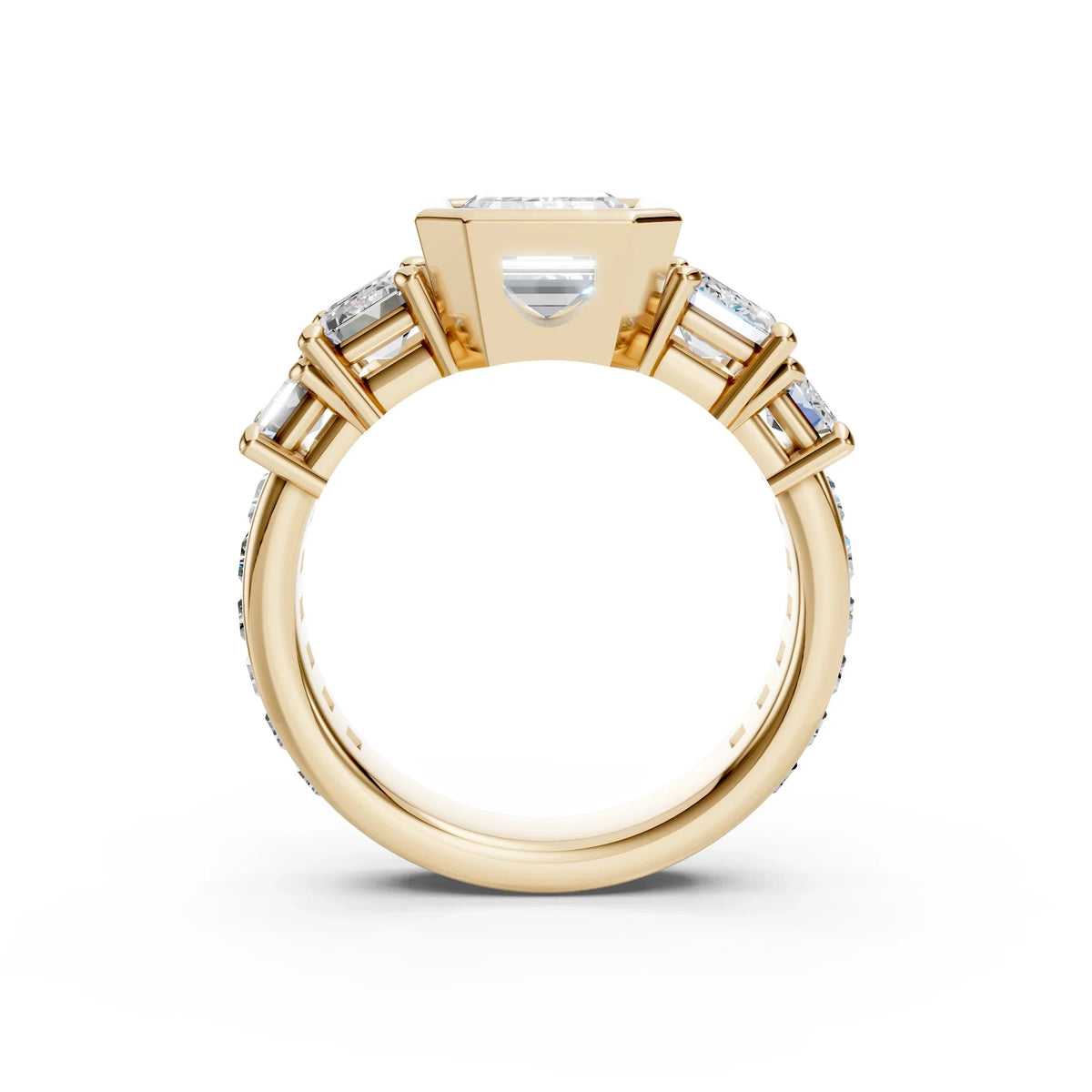 Graduated emerald cut lab diamond anniversary ring in yellow gold by Bel Viaggio Designs