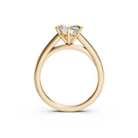 Side view of a Bel Viaggio Designs marquise engagement ring in yellow gold with a baguette setting