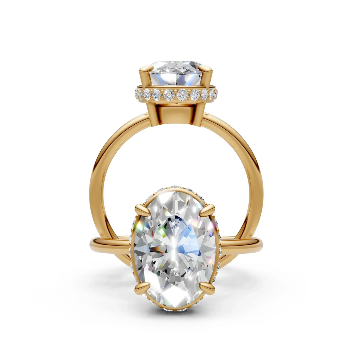 Oval-cut diamond engagement ring with yellow gold band and pavé halo setting