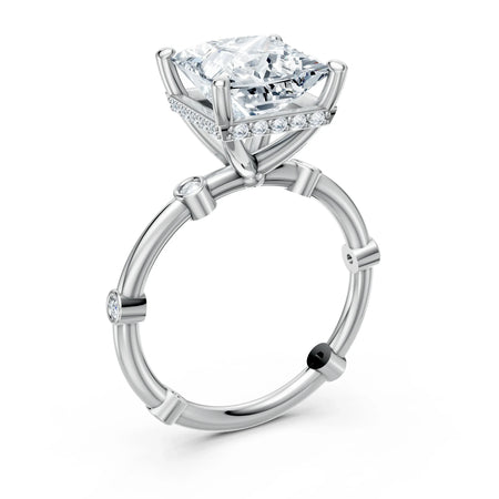 Platinum engagement ring with princess-cut center diamond and side accent stones