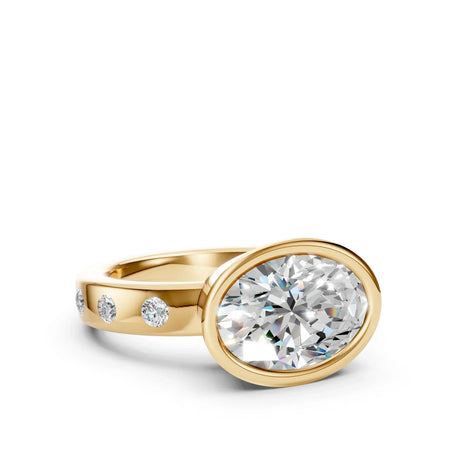 Oval diamond engagement ring in yellow gold with side accent stones