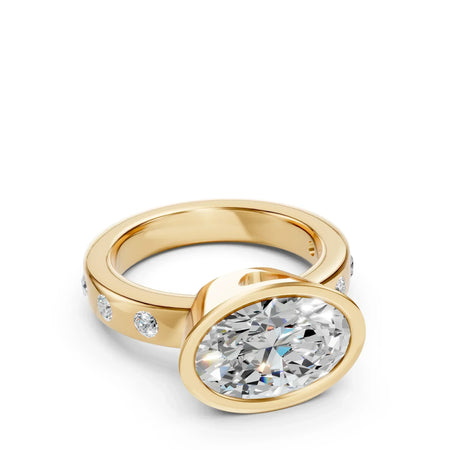 Yellow gold engagement ring with large oval diamond and side accent stones