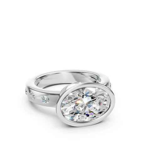 Oval-cut diamond engagement ring with side stones in a white gold band
