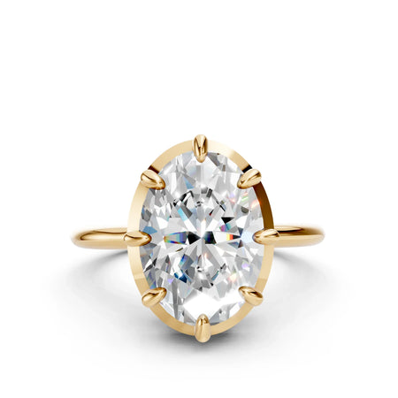 Oval solitaire engagement ring with large diamond on gold band
