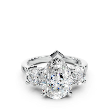 Pear-shaped diamond engagement ring with two round side diamonds on a white gold band