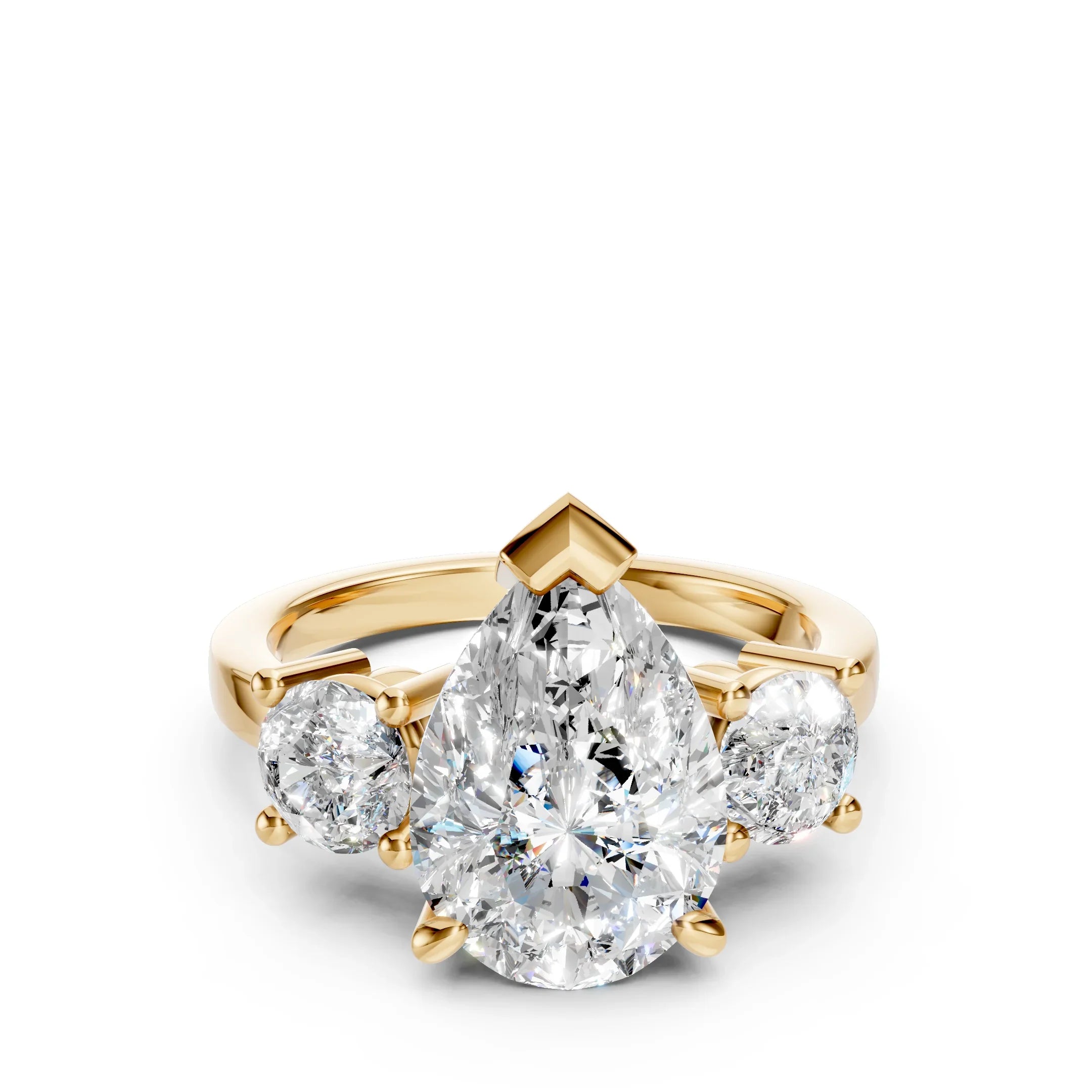 Yellow gold ring with a large pear-shaped diamond and two round side diamonds