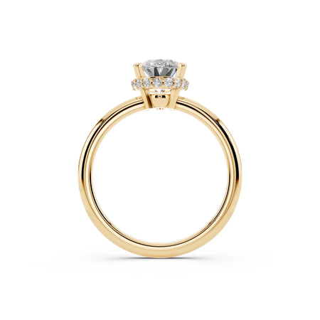 Yellow gold engagement ring with round solitaire diamond and pavé diamond halo