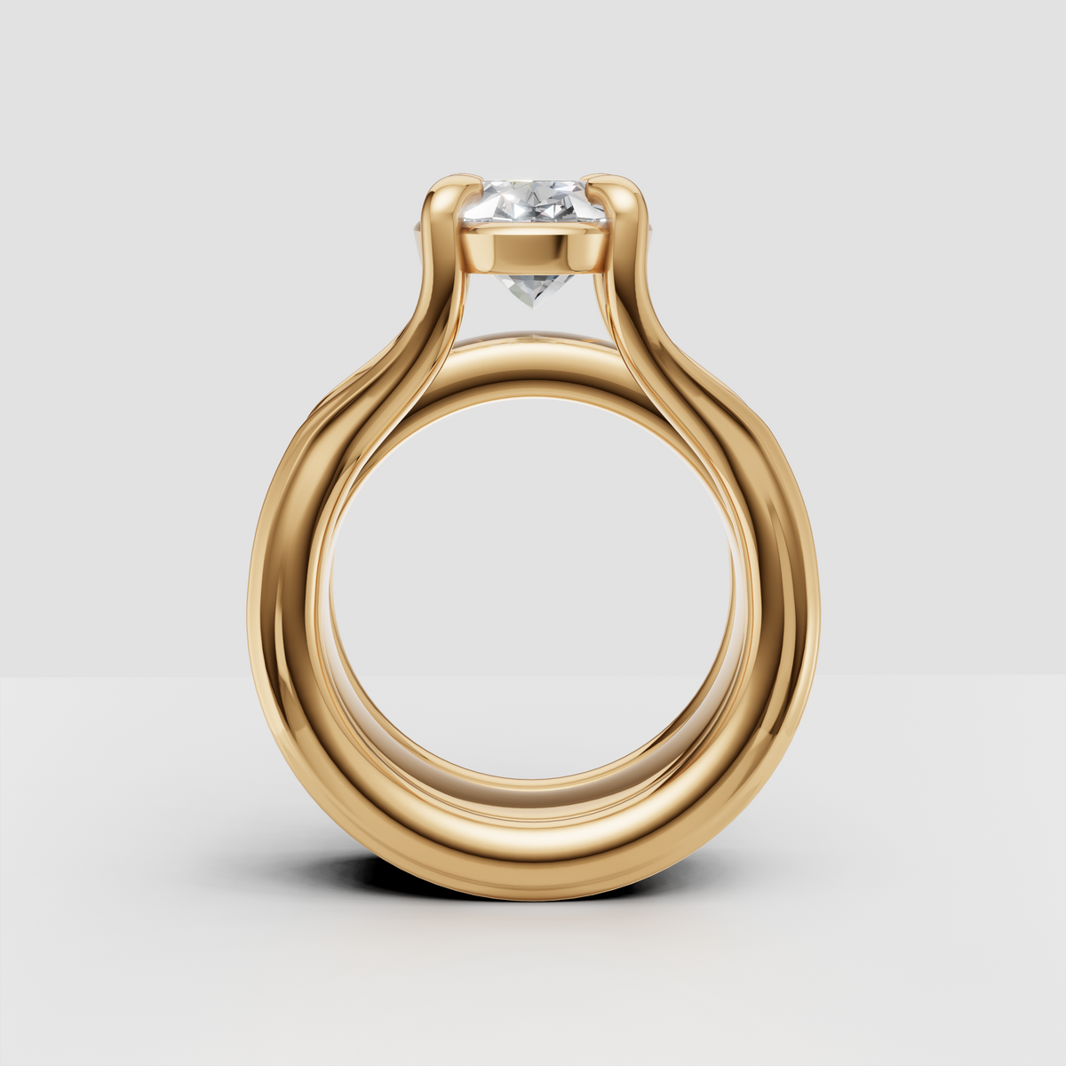 Yellow gold solitaire engagement ring with round diamond, modern open setting