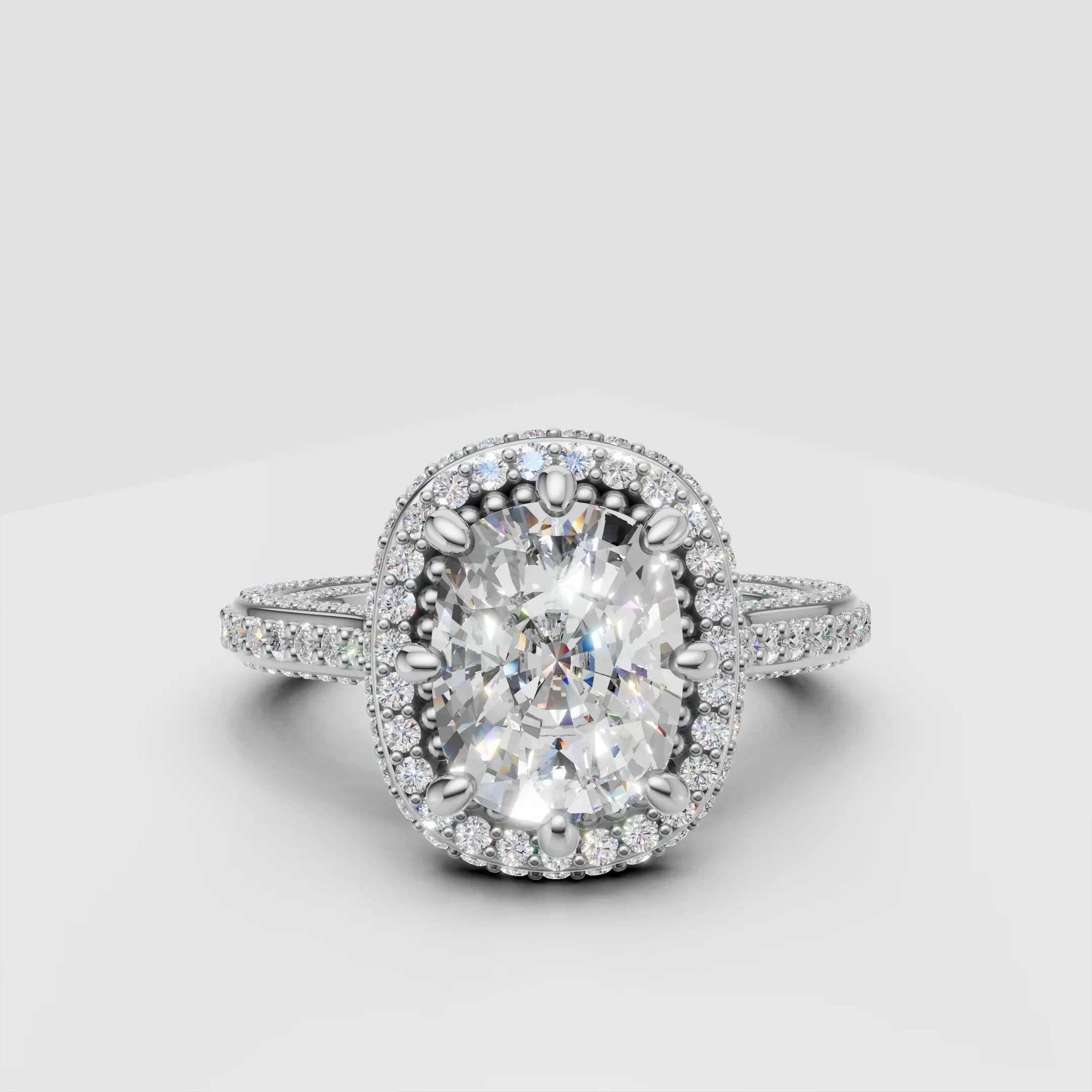Oval halo diamond engagement ring with pavé band on white background