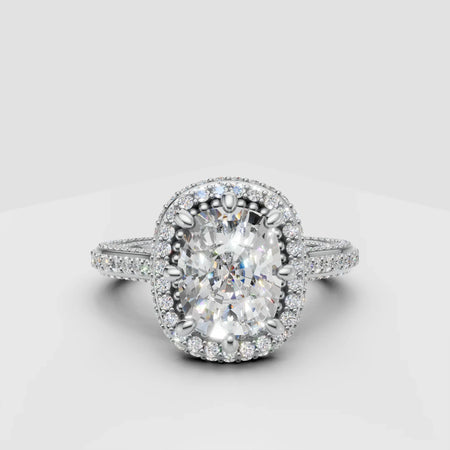 Oval halo diamond engagement ring with pavé band on white background