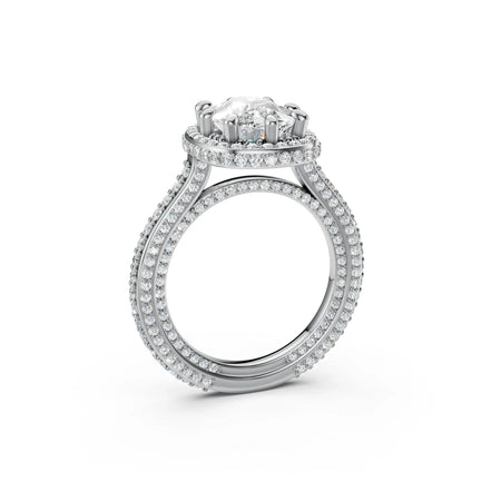 White gold engagement ring with round center diamond and pavé double halo setting