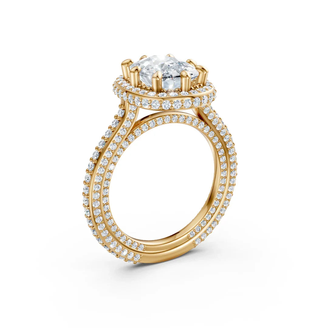 Yellow gold engagement ring with a cushion cut center diamond and pavé double halo