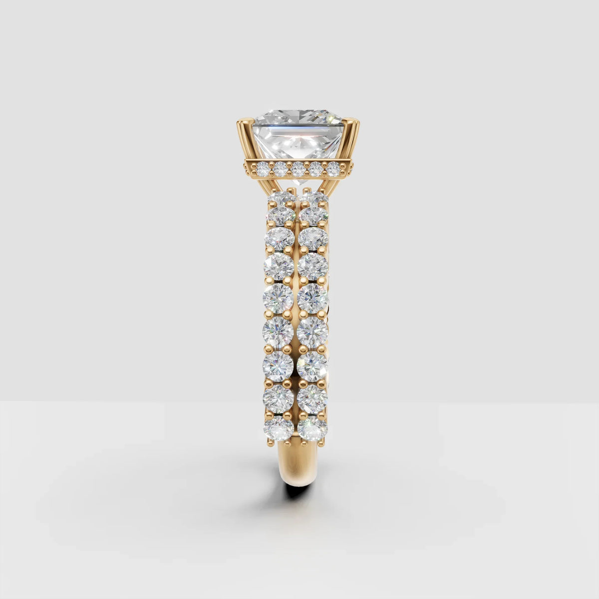 Gold engagement ring with large round diamond and pavé diamond band, side view