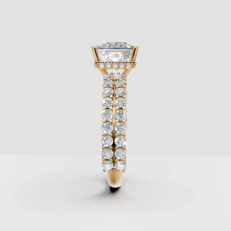 Gold engagement ring with large round diamond and pavé diamond band, side view
