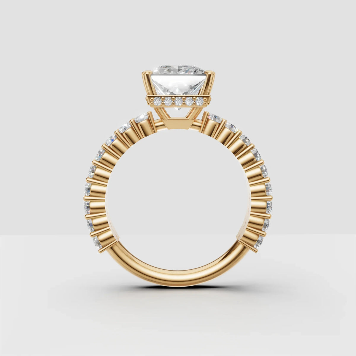 Yellow gold engagement ring with round diamond center and side accent diamonds