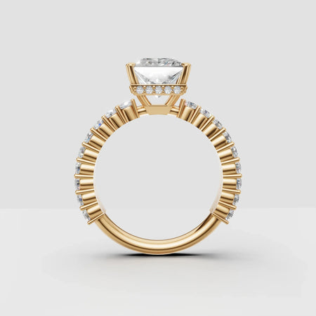 Yellow gold engagement ring with round diamond center and side accent diamonds