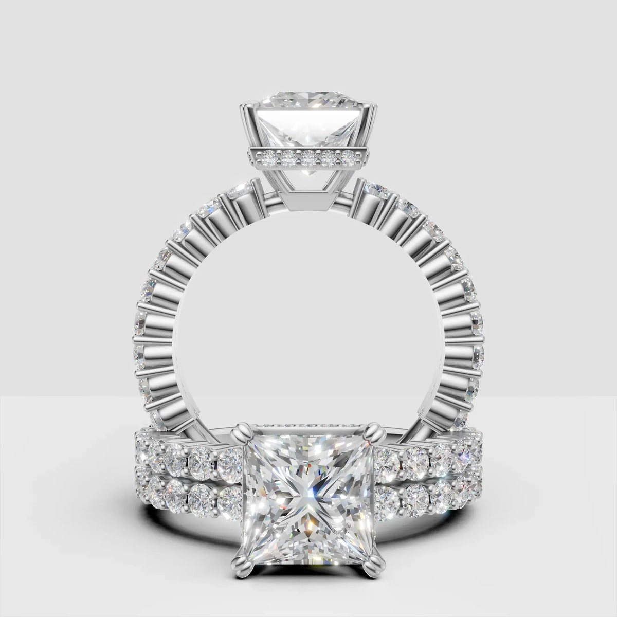 Princess cut diamond engagement ring with pavé band in white gold, custom jewelry design