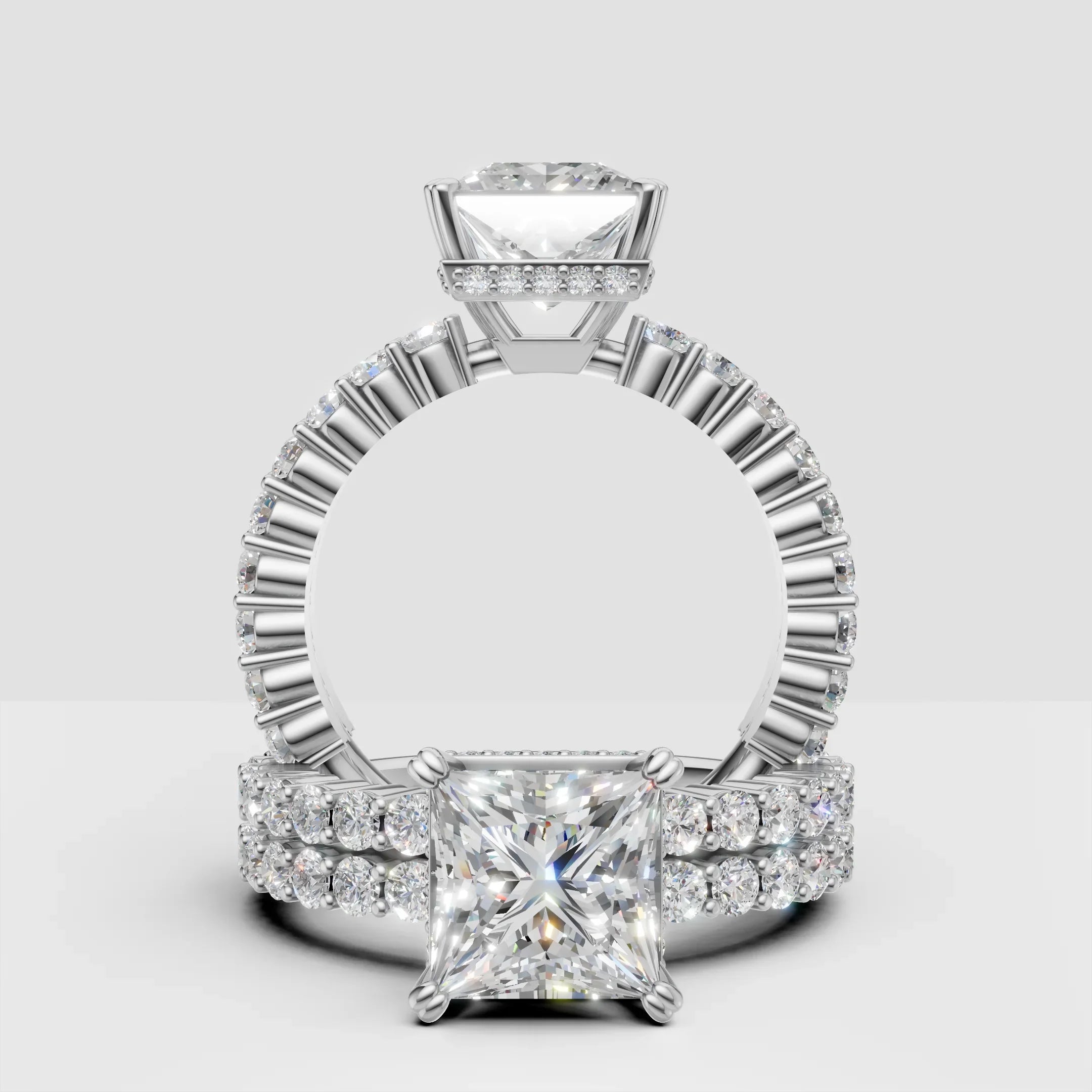 Princess cut diamond engagement ring with pavé band in white gold, custom jewelry design