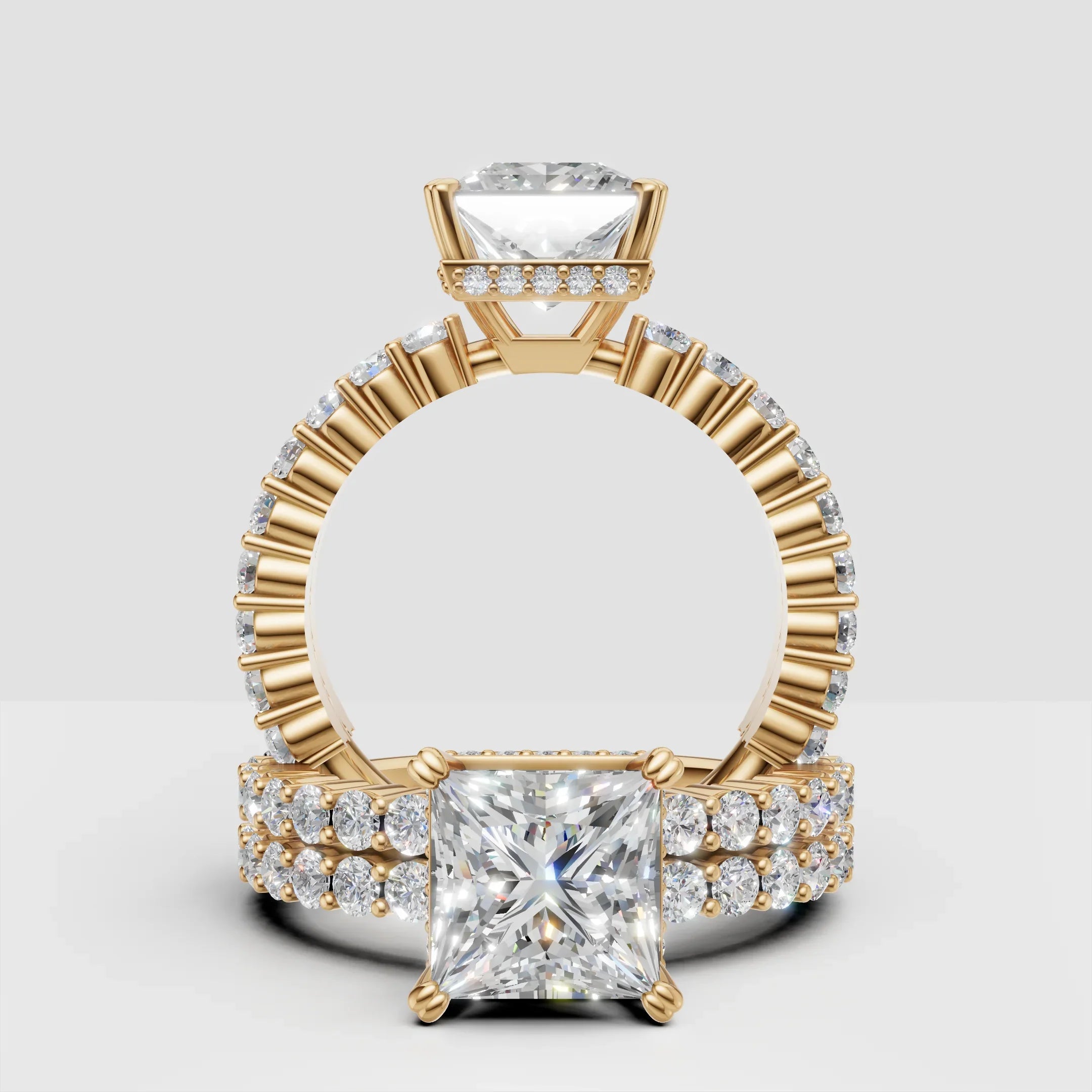 Princess cut diamond engagement ring with gold band and pavé side stones