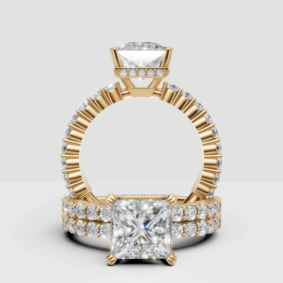 Princess cut diamond engagement ring with gold band and pavé side stones