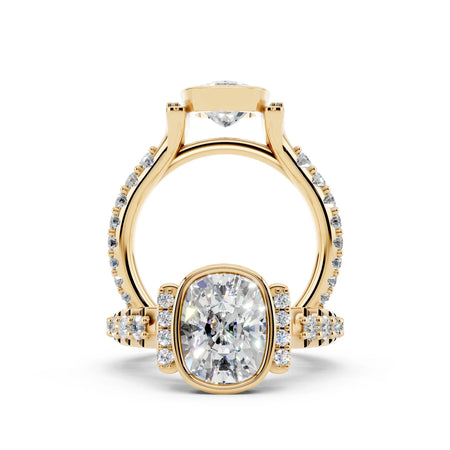 Custom yellow gold engagement ring with cushion-cut center diamond and pavé band