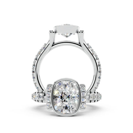 Cushion cut diamond engagement ring with pavé band and side stones in white gold